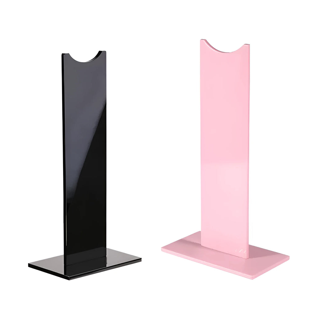 Pink and black detachable headphone stand on a desk with a non-slip silicone base.