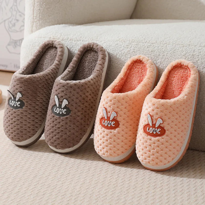 Women's rabbit plaid design artificial fur house slippers with thick rubber soles in apricot colour.