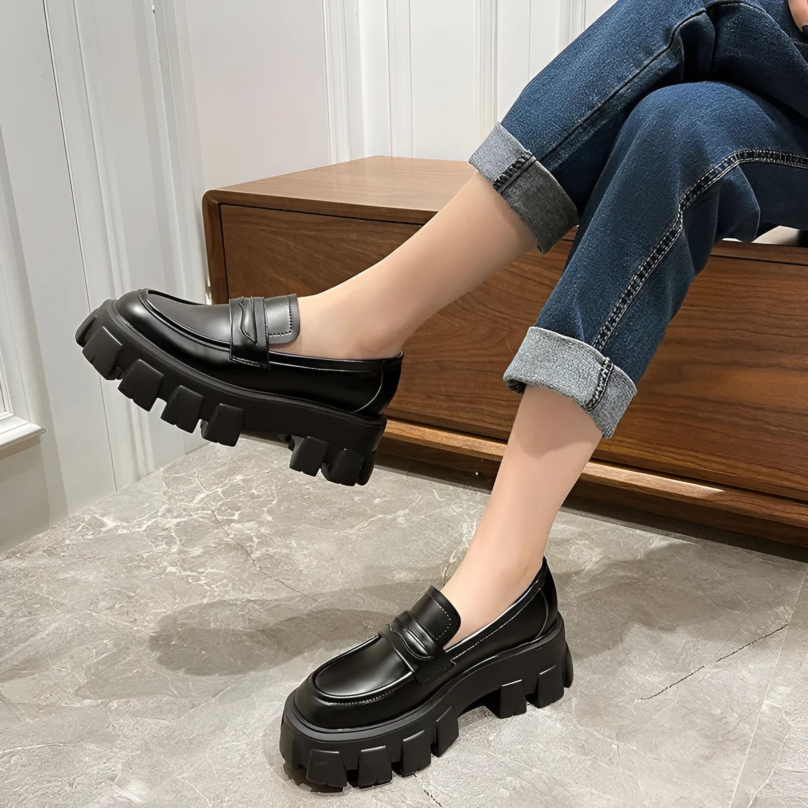 British style wide fat foot loafers in patent leather with a rubber sole.