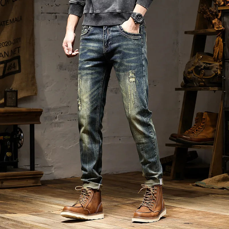 Men's skinny fit jeans in a retro colour with a zip fly, shown laid flat.