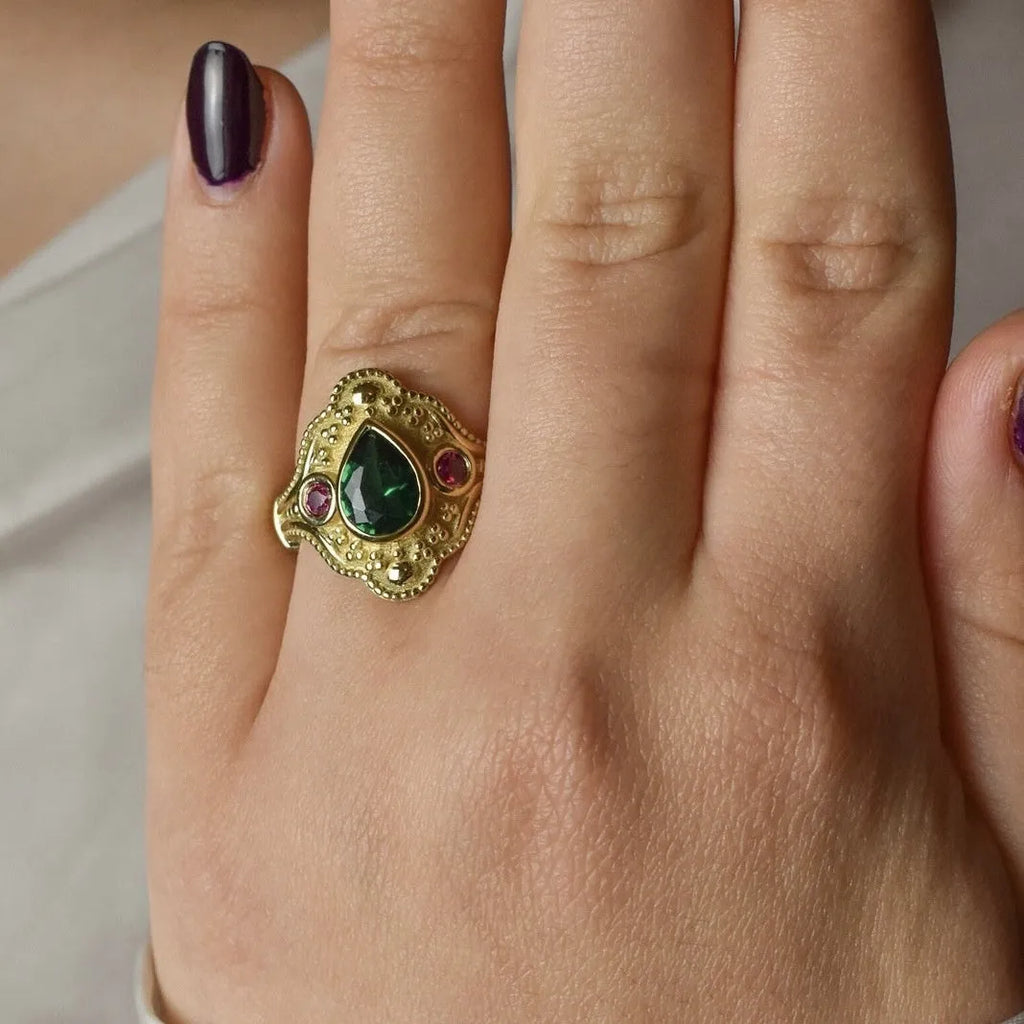 Women's geometric gold-plated ring with electroplated golden lvzuan finish shown from side view