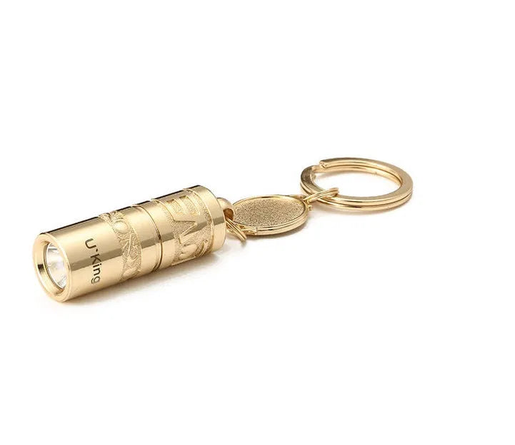 Gold zinc alloy waterproof LED keychain flashlight on a keyring.