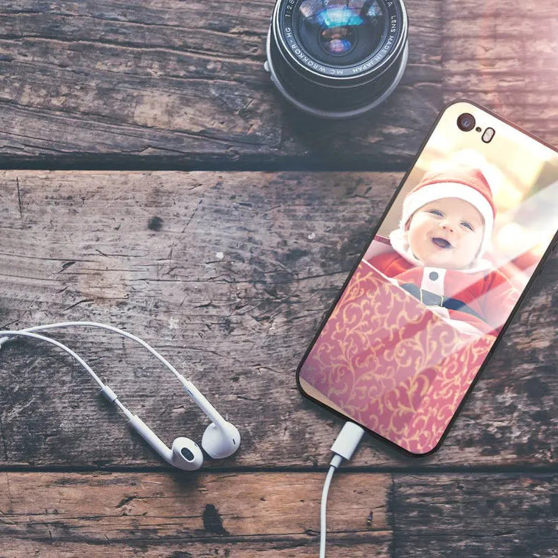 Slim hard back patterned case for iPhone with raised edge protecting camera and screen.