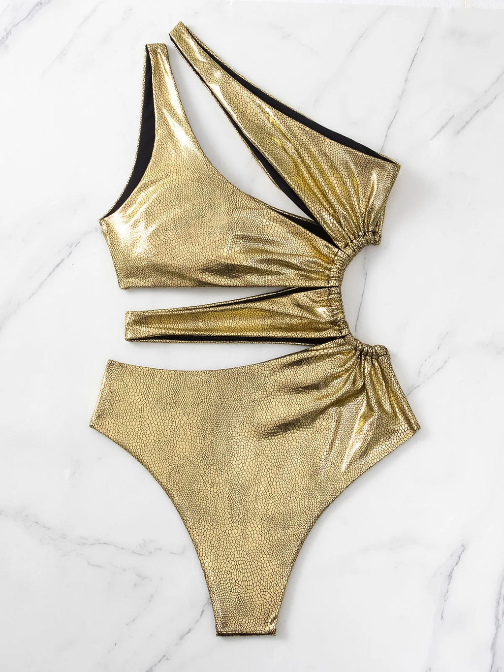 Women's gold one-piece swimsuit with backless design and high elasticity spandex construction.