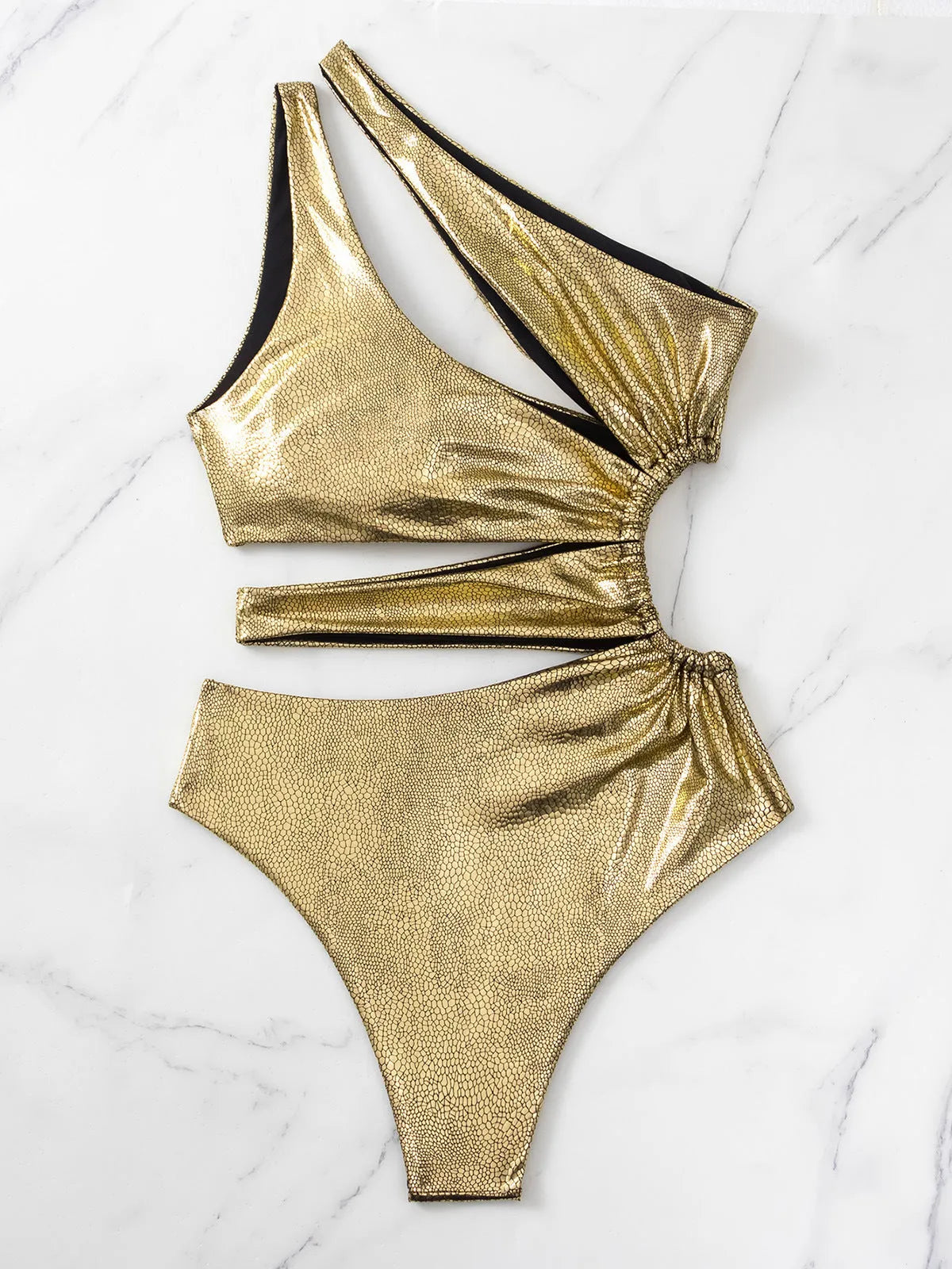 Women's gold one-piece swimsuit with backless design and high elasticity spandex construction.