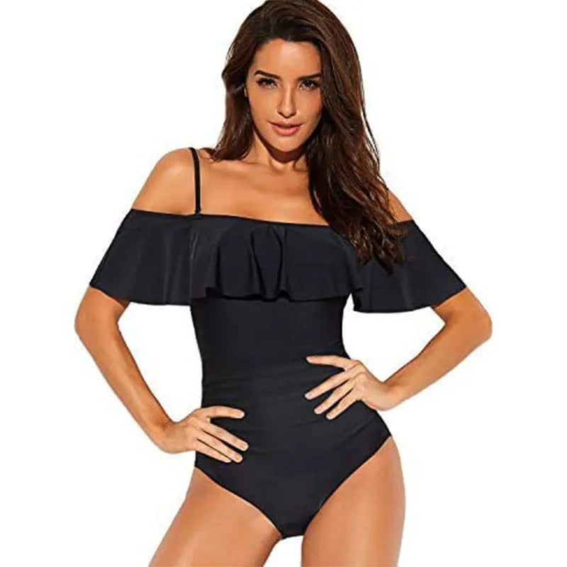 Black one-piece swimsuit with ruffled straps and side cut-out panels on a mannequin.