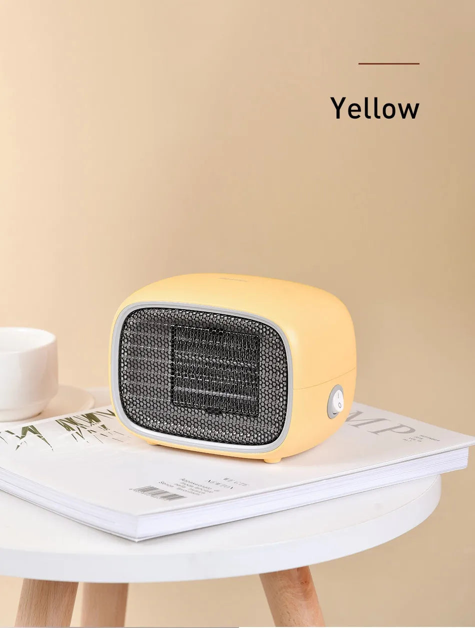Mini ceramic desk heater in green colour showing compact rectangular design with safety grille
