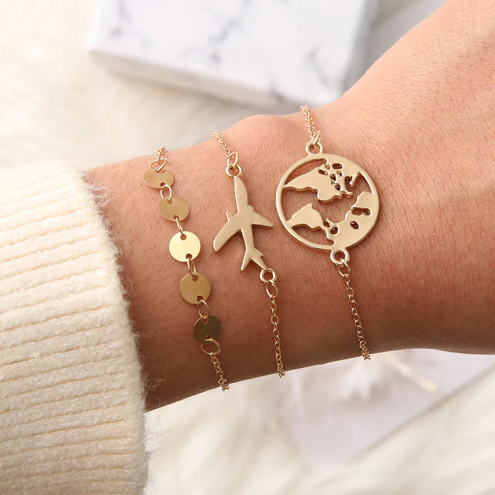 Three bohemian bracelets with aircraft map charm pendants in heart shape design
