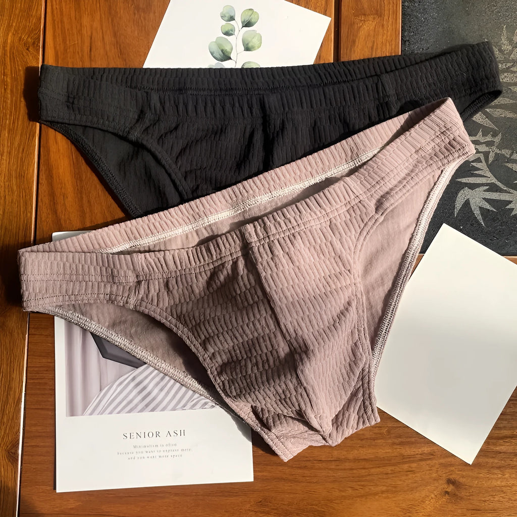 Men's solid colour cotton triangle underwear briefs with a mid waist design.