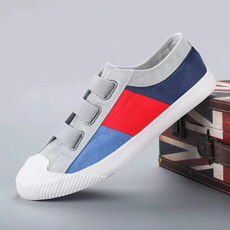 Men's low-top canvas sneakers in beige with elastic band closure and a vulcanised rubber sole.