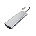 Grey aluminium USB-C docking station showing HDMI, VGA, USB 3.0, and USB-C PD charging ports.
