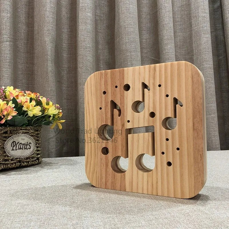 Square pine wood USB LED atmosphere lamp emitting warm white light on a desk.