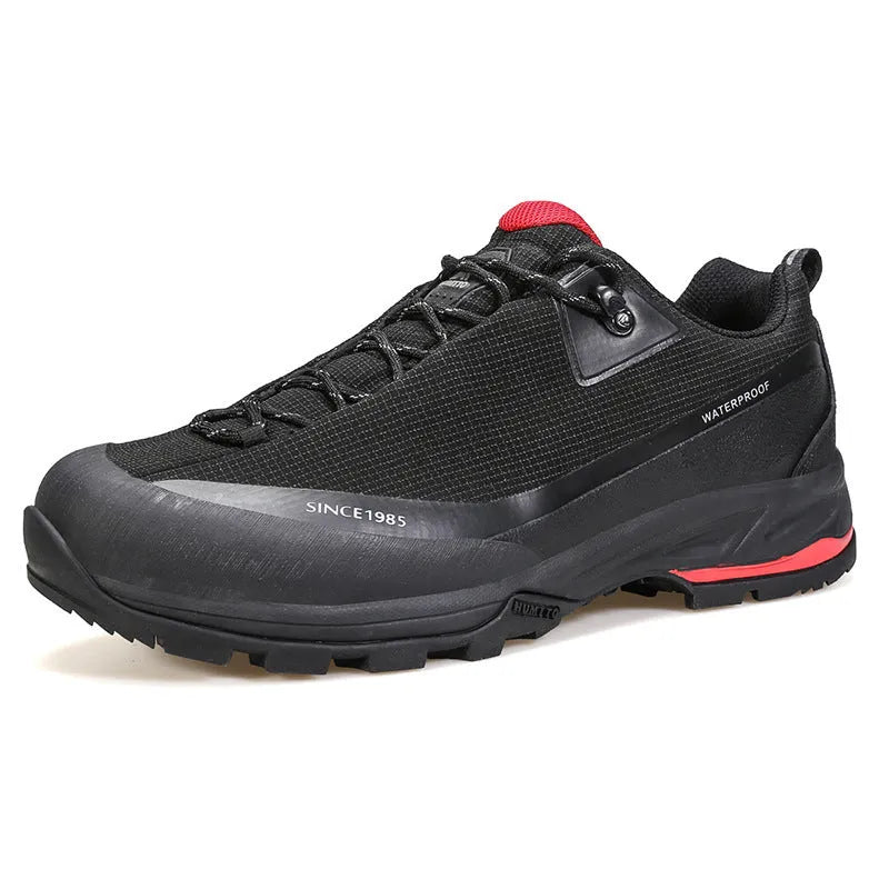 Men's low-top casual hiking boots in black with leather mesh upper and lace-up front.