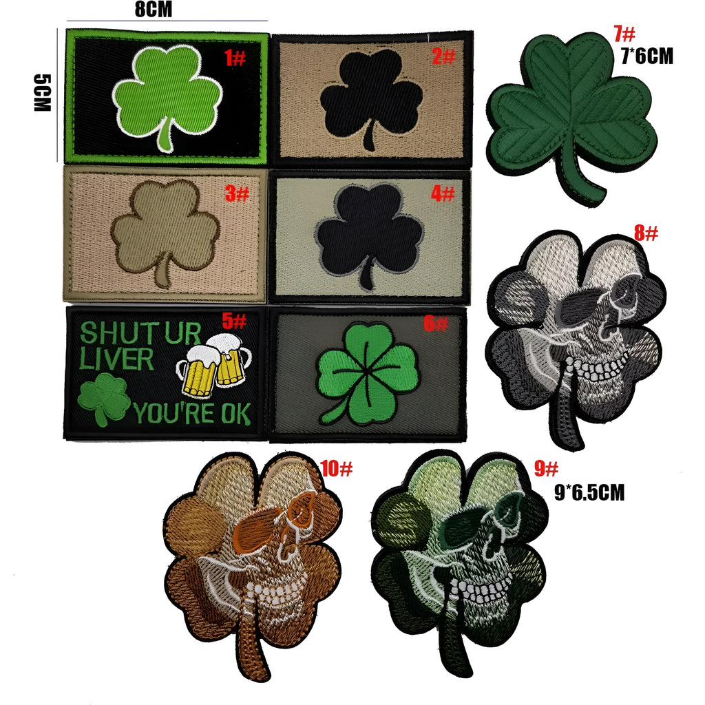 Embroidered green clover design Velcro fabric badge patch on a hook and loop strip.
