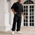Men's apricot coloured cotton linen short-sleeved shirt jacket and trouser casual set laid flat.