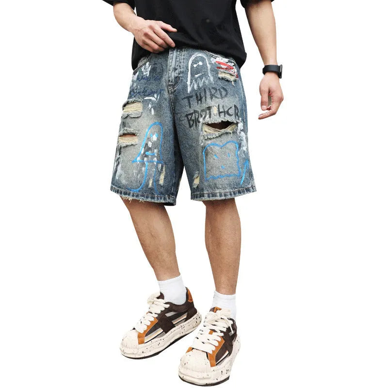 Men's blue ripped jeans shorts with graffiti details and straight leg opening