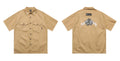 Men's black cotton blend loose fit shirt with half sleeves and embroidered detail.