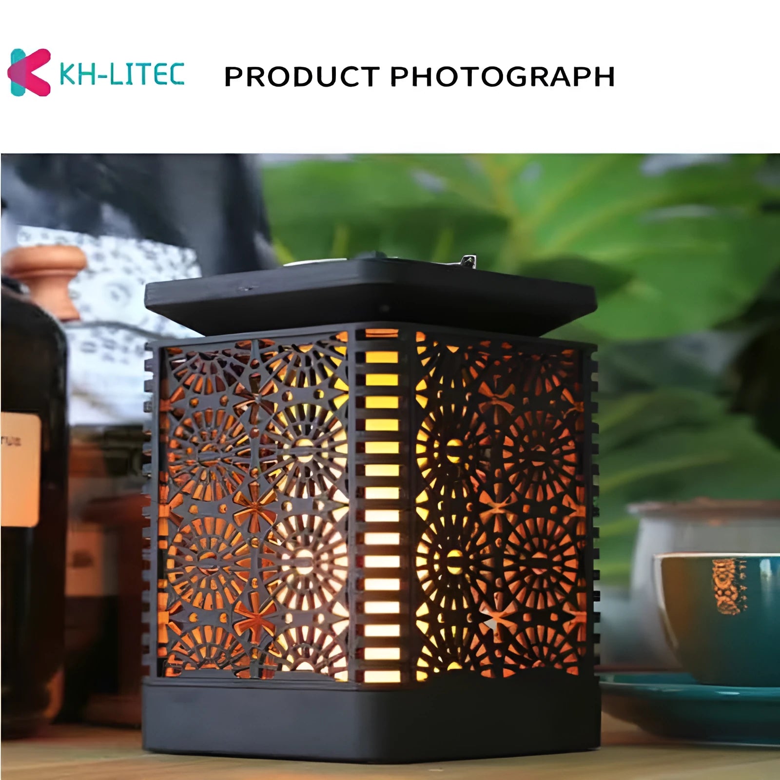 Set of four black solar-powered hanging garden lights with a flickering flame LED effect.