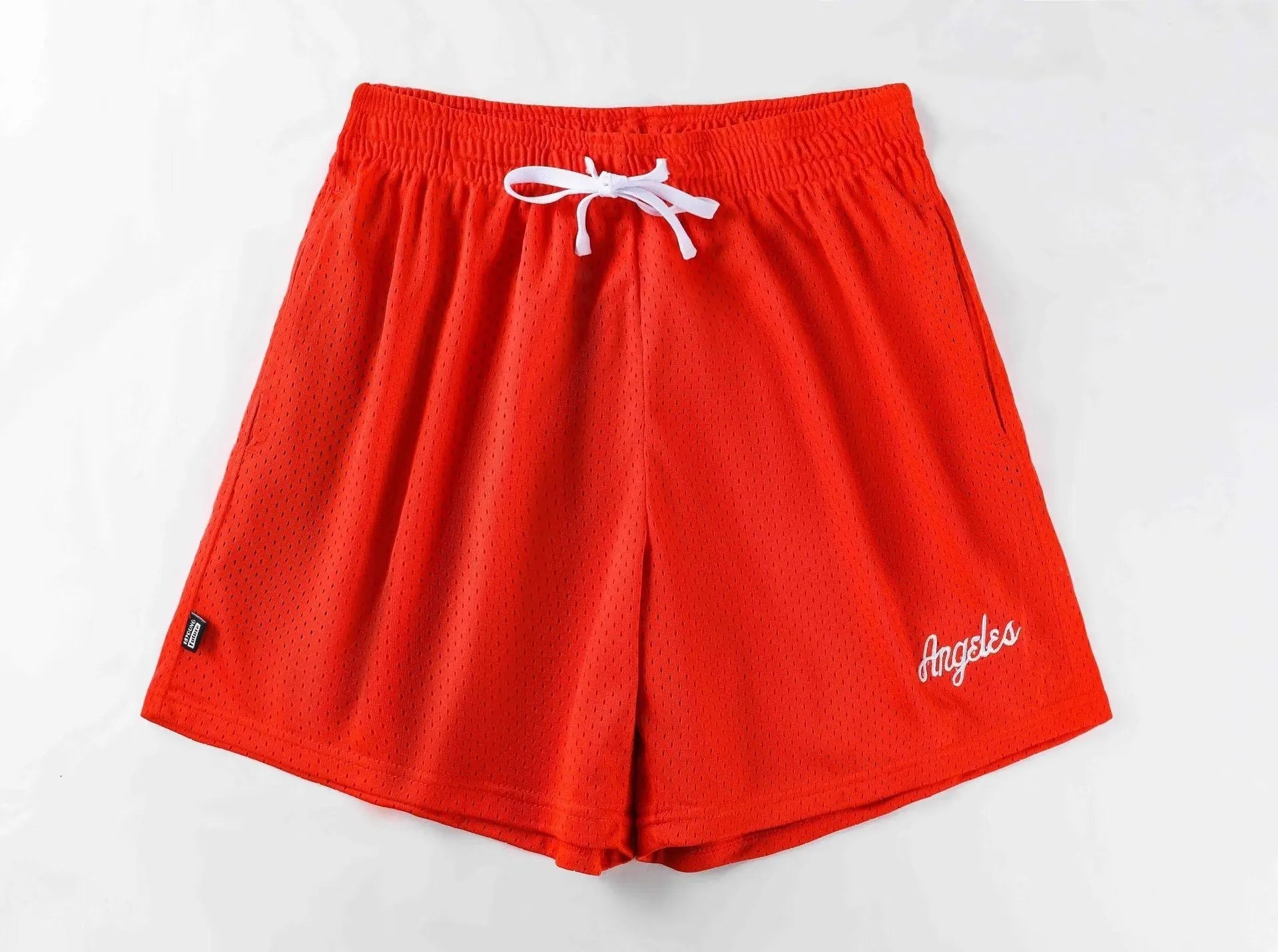 Men's black double-layer mesh sports shorts made from polyester fabric on a white background.