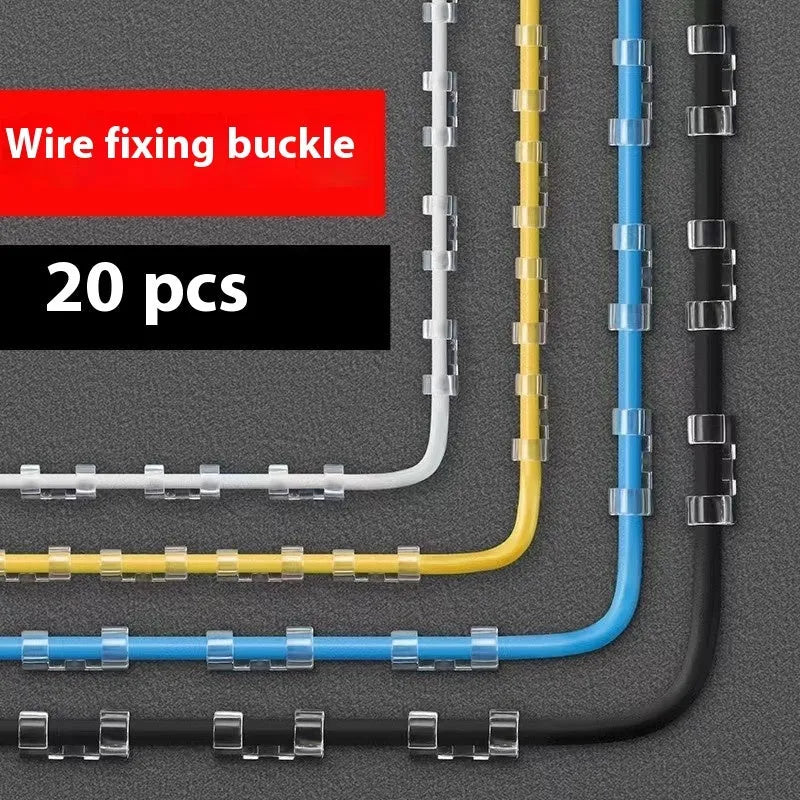 Transparent plastic self-adhesive cable clips for wire management on a desk.