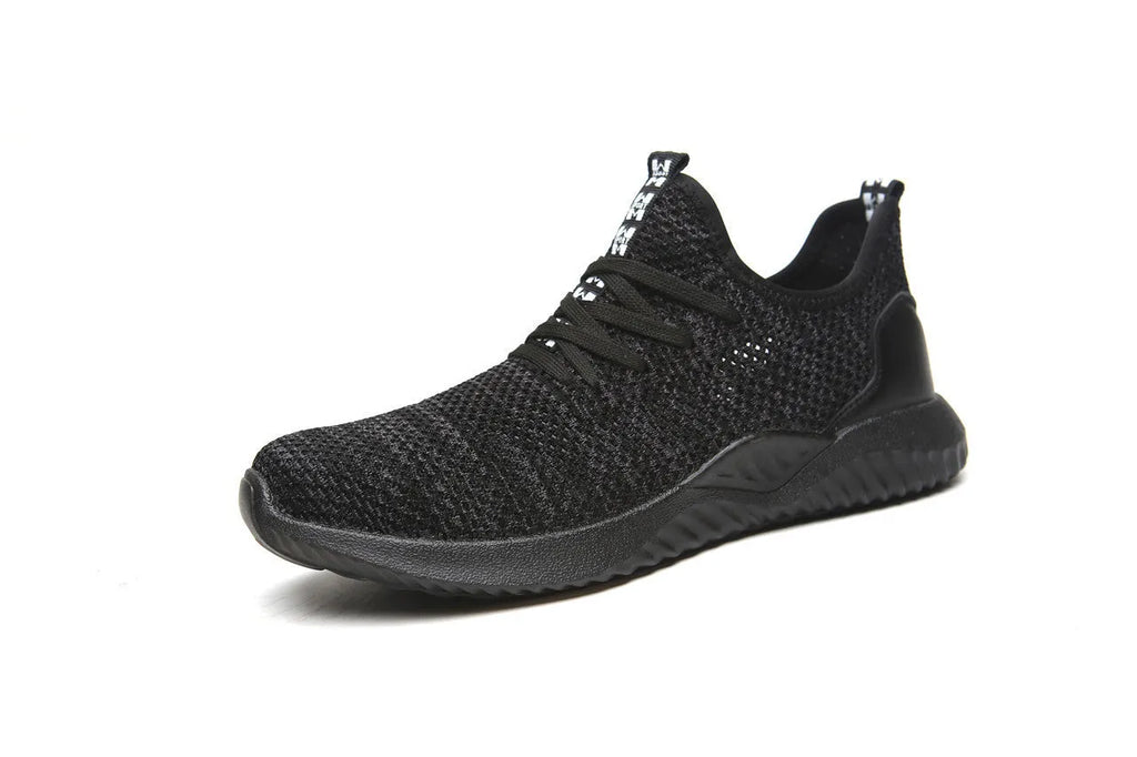 Black low-cut steel toe safety shoes with anti-static EVA sole on a work surface