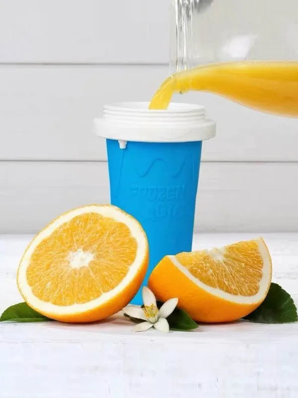 Blue silicone freeze cup with pinch design for chilling smoothies, showing double-layer construction and built-in coolant.