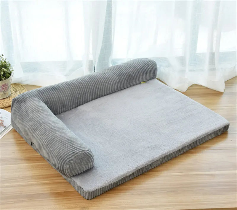 Corduroy pet sofa dog bed in grey, showing removable cover and non-slip base, placed on a hardwood floor.