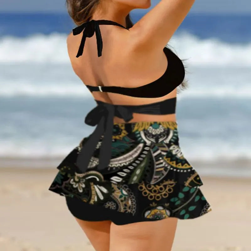 Women's purple two-piece swimsuit with separate skirt and lace-up details on high-waisted briefs