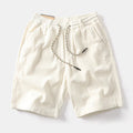 Men's khaki cargo shorts with straight-leg cut and retro American street style
