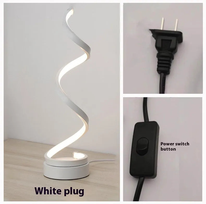 Minimalist black and white LED bedside lamp with aluminium shade measuring 125x450mm