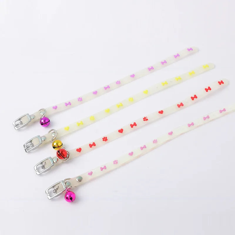 Cat wearing luminous collar with adjustable 29cm silicone chain and metal bell in night setting