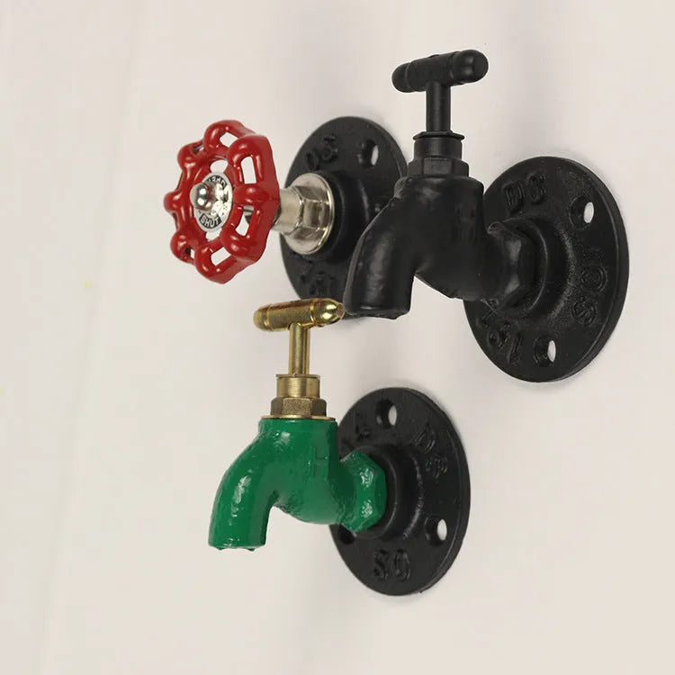 Modern water pipe style metal towel rack hook mounted on a wall in black finish.