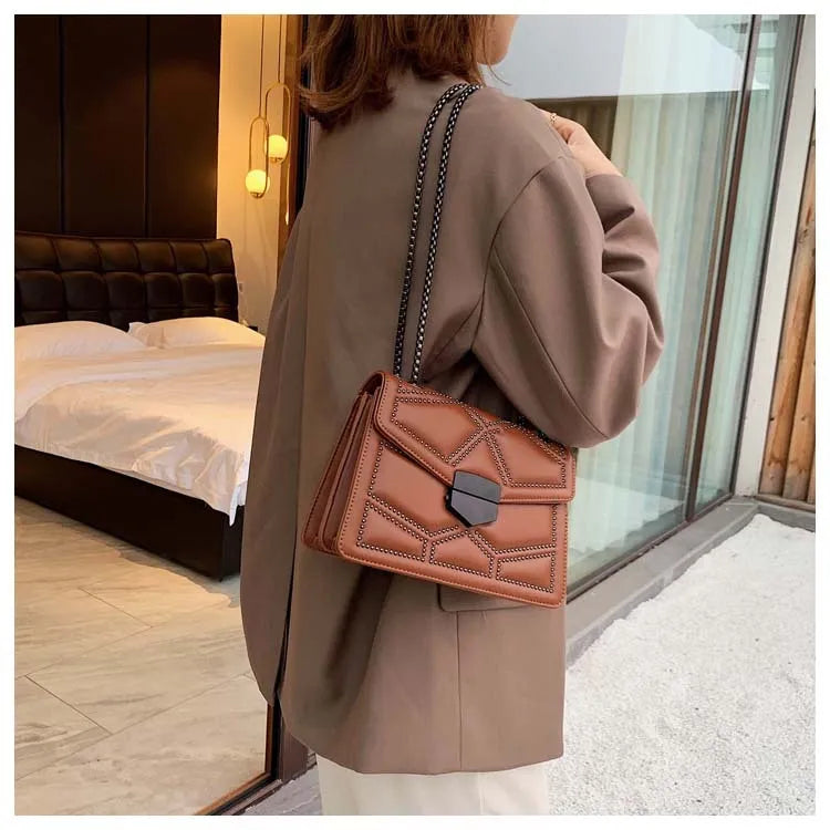 Small square PU shoulder bag with gold rivet studs, chain handle and zipper closure, available in four colours