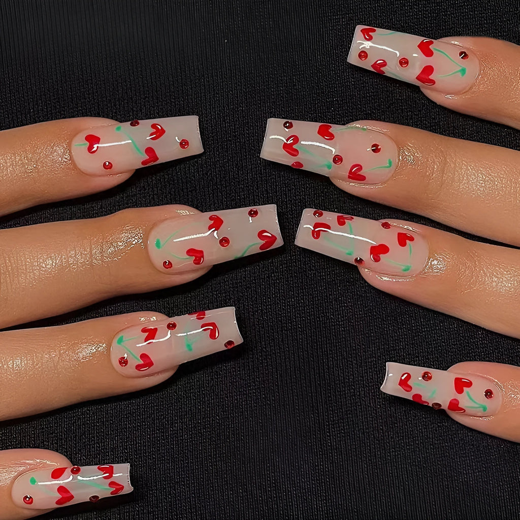 Red diamond and small cherry pattern French tip nail art stickers in a pack of 24 with adhesive glue.