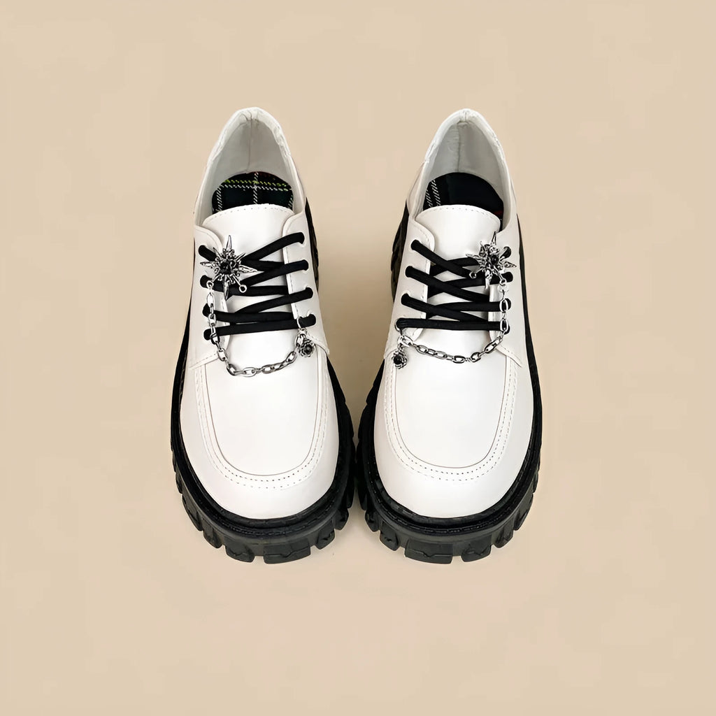 Women's Duke Asterism preppy loafers with a cross shoulder strap and metal detail.