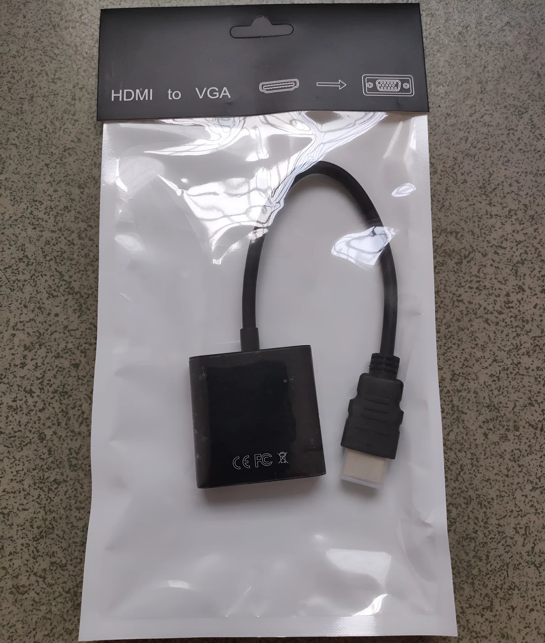 Black HDMI to VGA converter adapter cable, 0.3 metres long, with male HDMI and female VGA connectors.