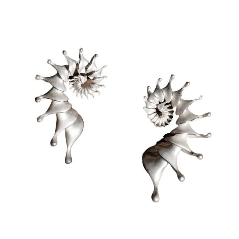Three-dimensional matte finish conch stud earrings with exaggerated shape and irregular design elements