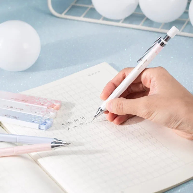 0.5mm automatic pencil set with Sakura cartoon design showing three pens and three HB refill boxes