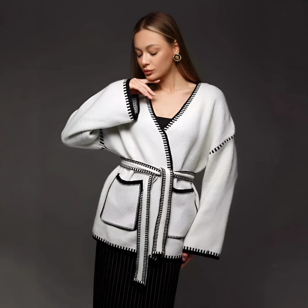 Loose fit knitted cardigan with lace-up sleeves in camel colour showing mid-length design