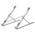 Grey folding aluminium alloy laptop bracket with silicone grip on a desk, angled to hold a notebook