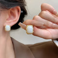 Hand-woven geometric circular metal earrings in mixed materials with Korean style design