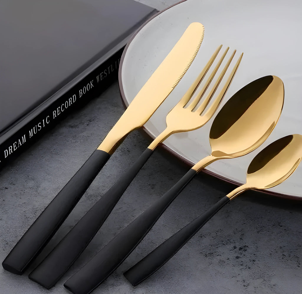 Four-piece stainless steel cutlery set in black with mirror polished finish