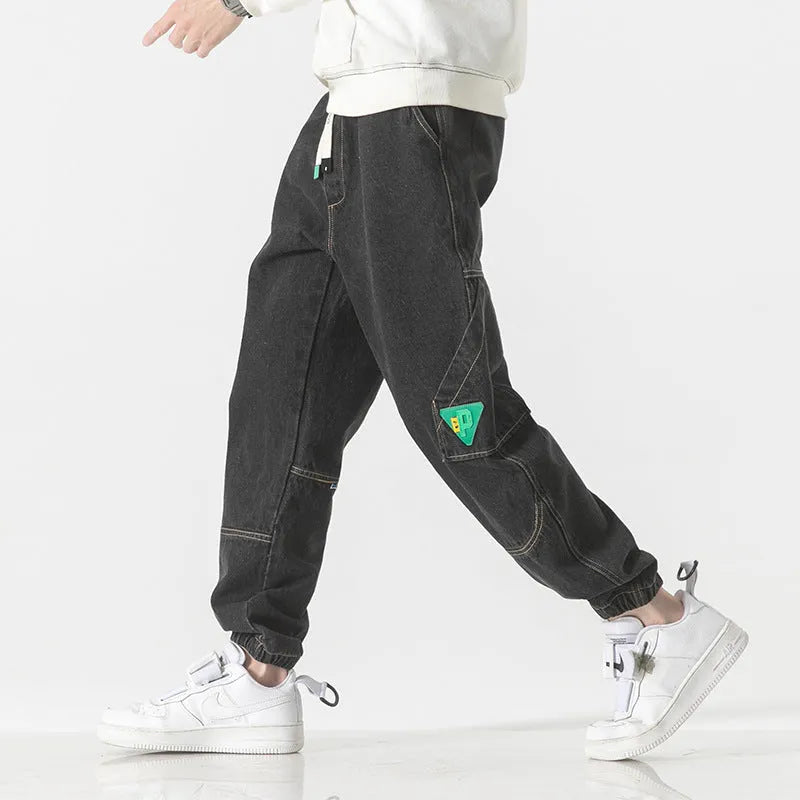 Men's loose-fit tapered cotton trousers in black, available in sizes from M to 8XL