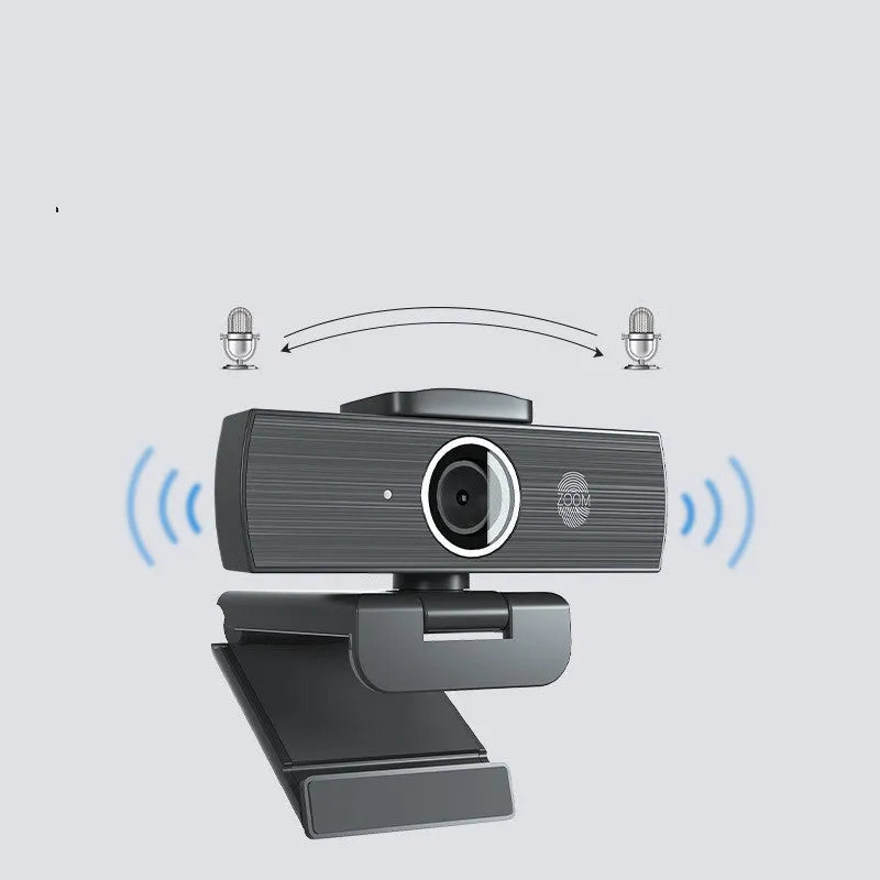 Black 4K USB webcam on a desktop with a magnetic privacy cover next to it