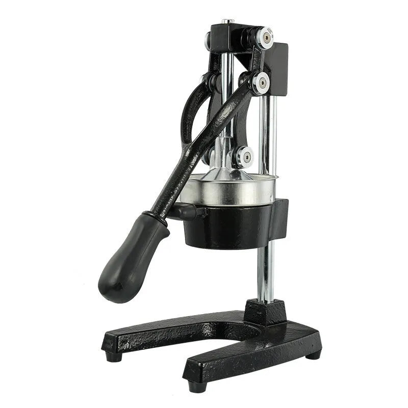 Black manual cast iron citrus juicer with stainless steel strainer on a kitchen counter.