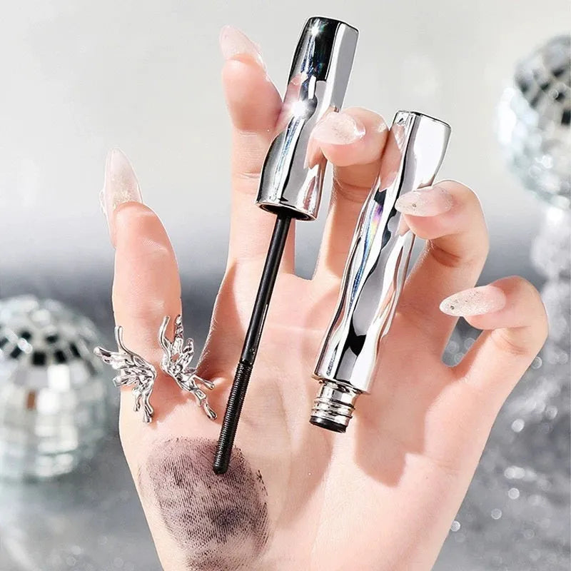 Waterproof mascara in black and brown steel tubes with optional eyelash curler