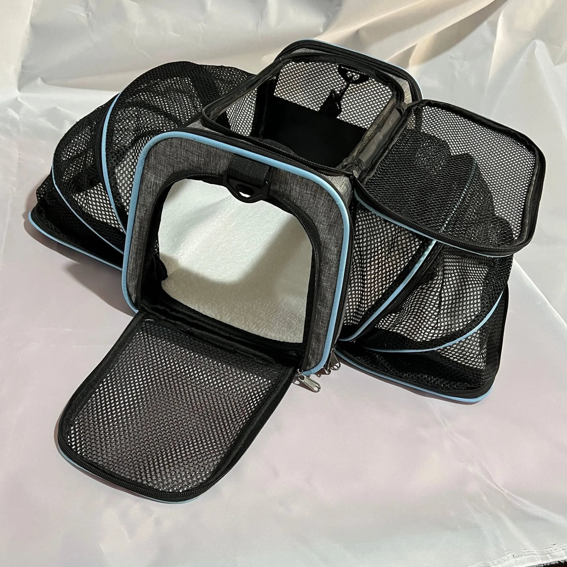 Large capacity cat carrier bag in black with red piping, made from 600D cation material