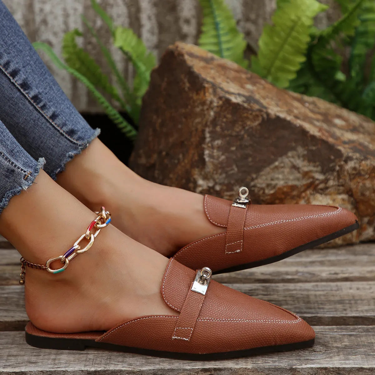Light brown women's pointed-toe low-heel semi-slippers with a PU upper and rubber sole.