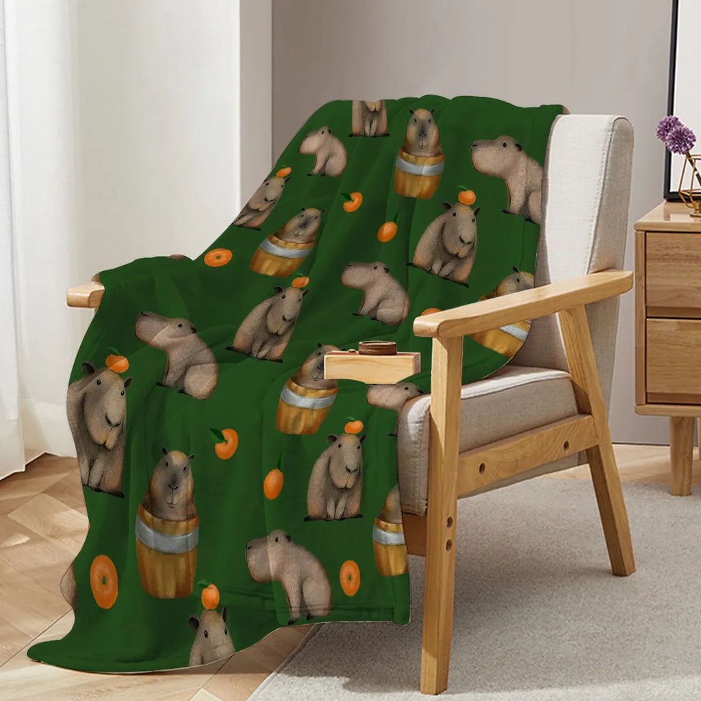 Flannel orange and capybara pattern soft fluffy multifunctional printed blanket on sofa