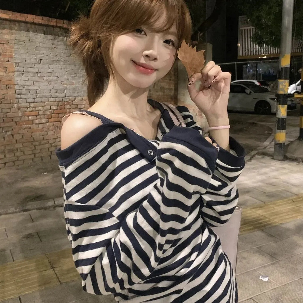 Dark blue Korean-style oversized women's long-sleeve t-shirt with stripe and embroidery detail.